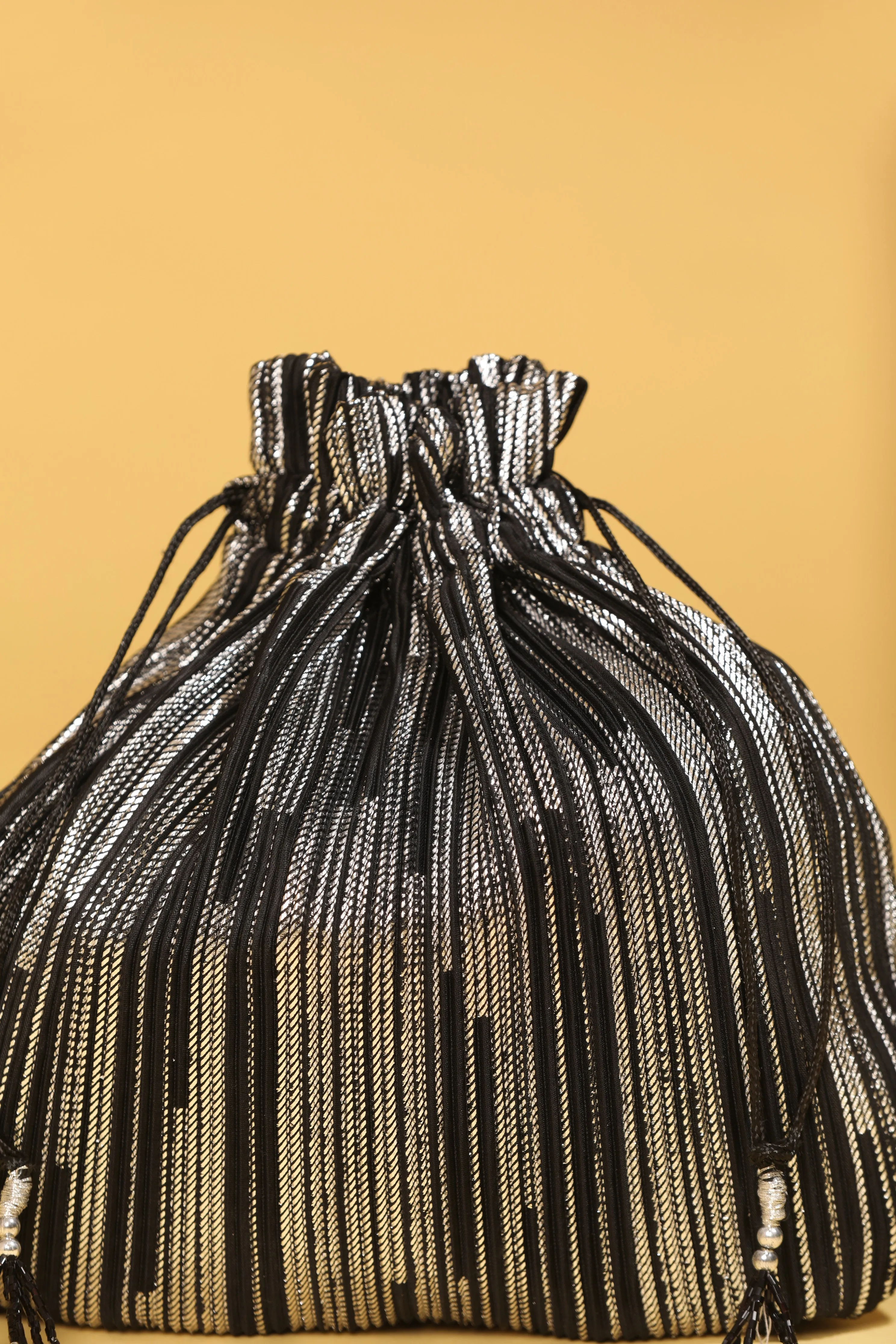 Black Bead Work Potli Bag with Sequin Detailing and Long Tassels