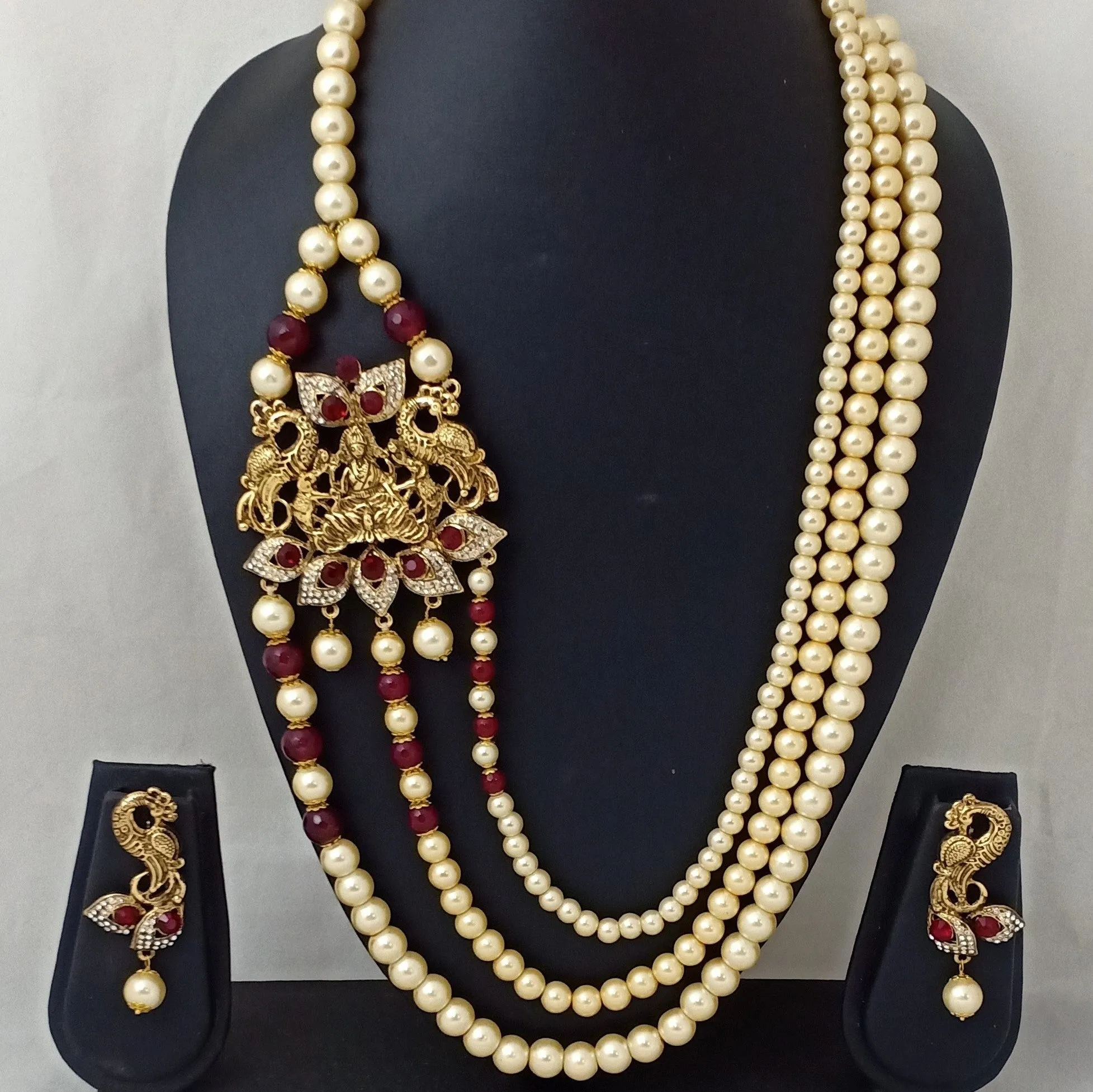 Estele Gold Plated Antique 3 Lines Pearl Necklace with Laxmi Devi & Peacock Finish Necklace Set with Austrian Crystals,Ruby stones & Red Beads for Women